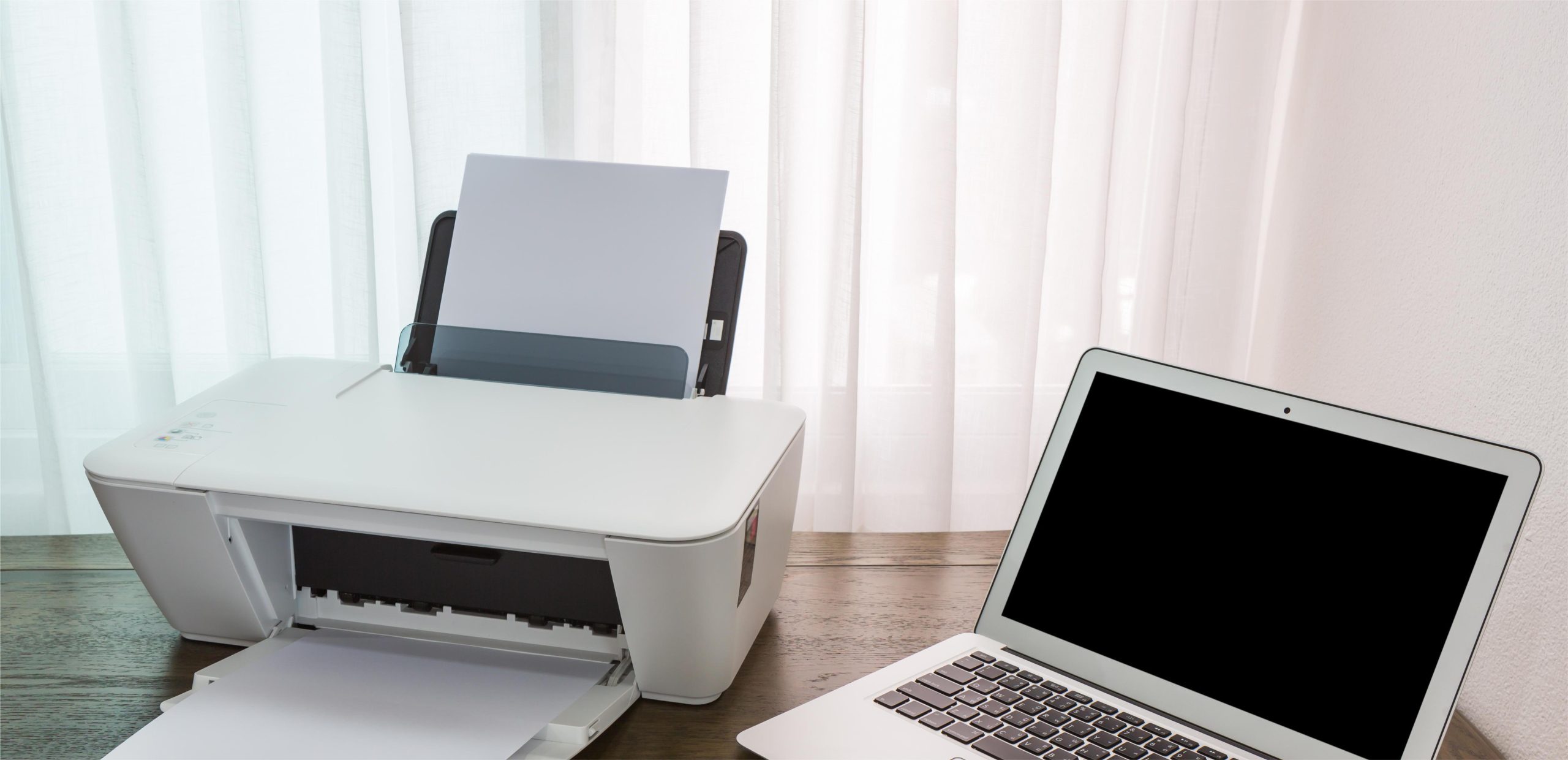 laptop-wooden-table-with-printer